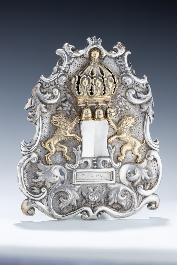 A VERY LARGE SILVER TORAH SHIELD. Vienna, c. 1860. Chased with lions, a decalogue, flowers, a crown (1 of 1)