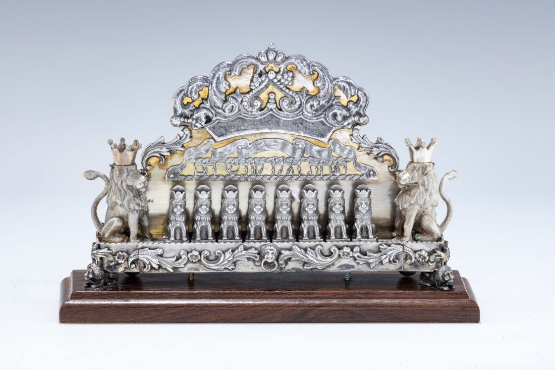 A SMALL SILVER HANUKKAH LAMP BY SHUKI FREIMAN. Israel, c. 1986. In old German style. Decorated with (1 of 4)