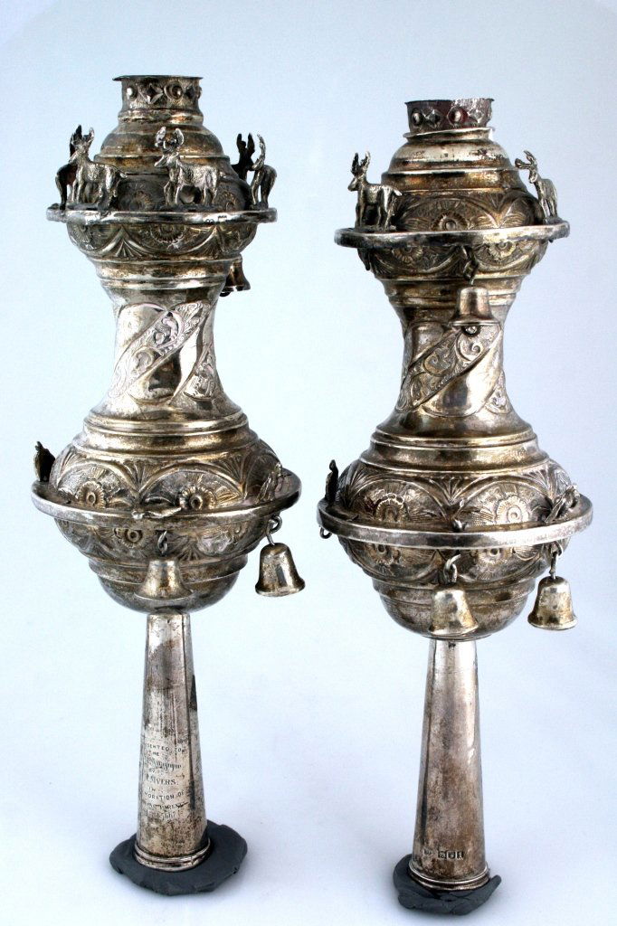 A PAIR OF EDWARDIAN SILVER TORAH FINIALS BY RUEBIN: A PAIR OF EDWARDIAN SILVER TORAH FINIALS BY RUEBIN KOSHER. London, 1906. foliate chased with mostly missing applied birds, stags and bells. Finals also lacking. Engraved: “PRESENTED TO THE CENTRAL S