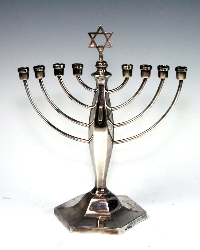 A SILVER MENORAH. Birmingham, c. 1920.: A SILVER MENORAH. Birmingham, c. 1920. On octagonal base. Lacking servant lamp. Marked. 9” tall