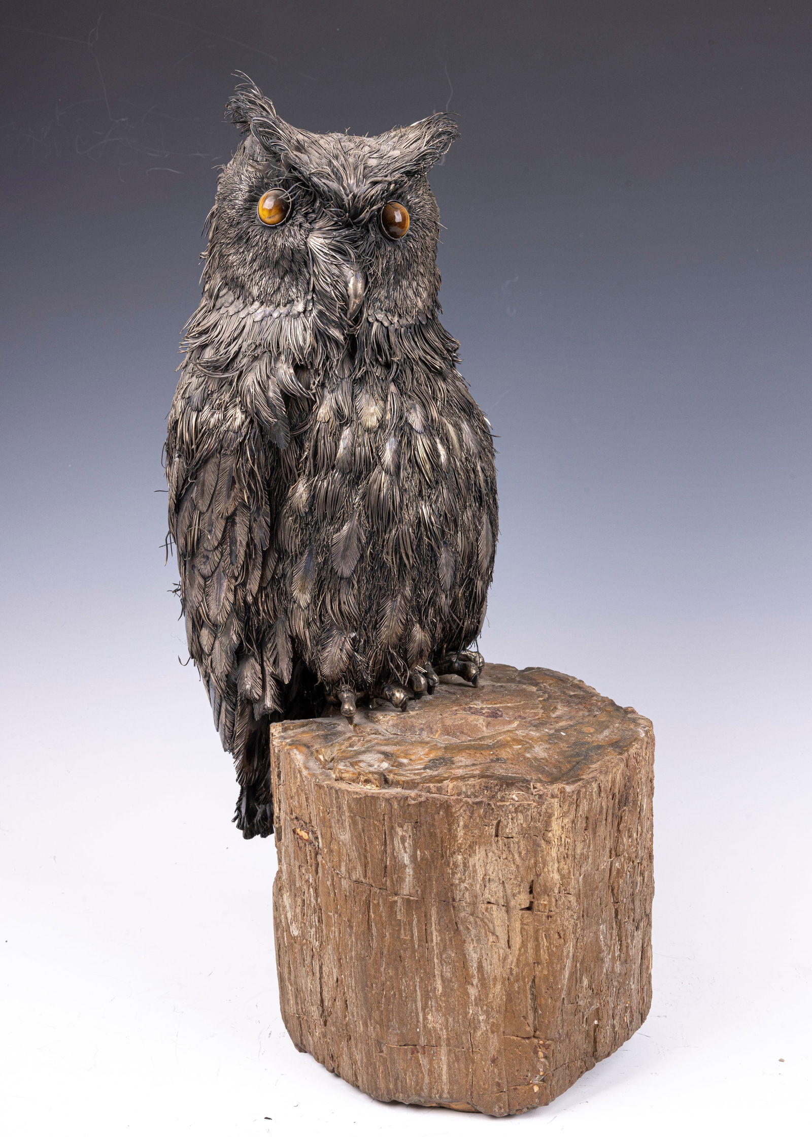 AN EXCEPTIONALLY LARGE BUCCELLATI SIGNED SILVER OWL MOUNTED ON A PETRIFIED WOOD BASE (1 of 8)