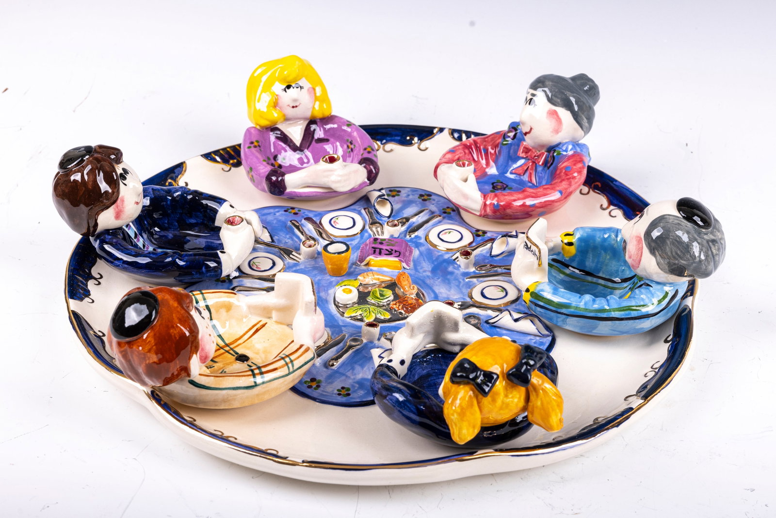 A LARGE NEW CERAMIC SEDER TRAY: Decorated with a whimsical set up of a Seder dinner