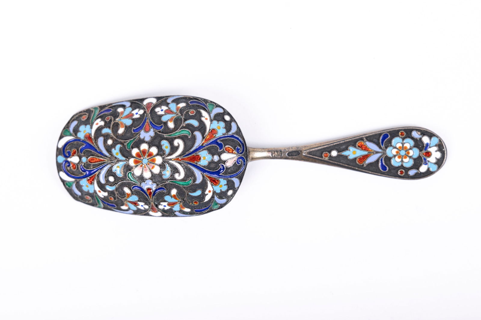 A SILVER AND EMAMEL SUGAR SHOVEL. Russia, 20th century. Decorated with hand applied colorful enamel. (1 of 5)