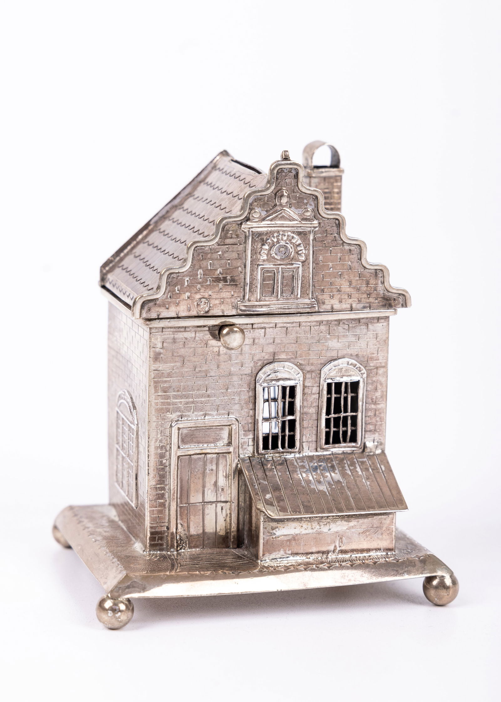 A SILVER CHARITY BOX. Dutch, c 1900. Formed in the shape of shop. Marked. 3.5" tall. (1 of 8)