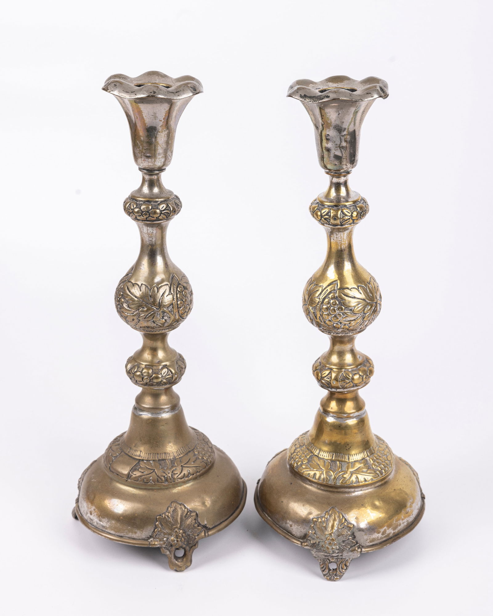 A PAIR OF BRASS SABBATH CANDLESTICKS BY SZEKMAN. Warsaw, c. 1900. On circle bases that are supported (1 of 1)