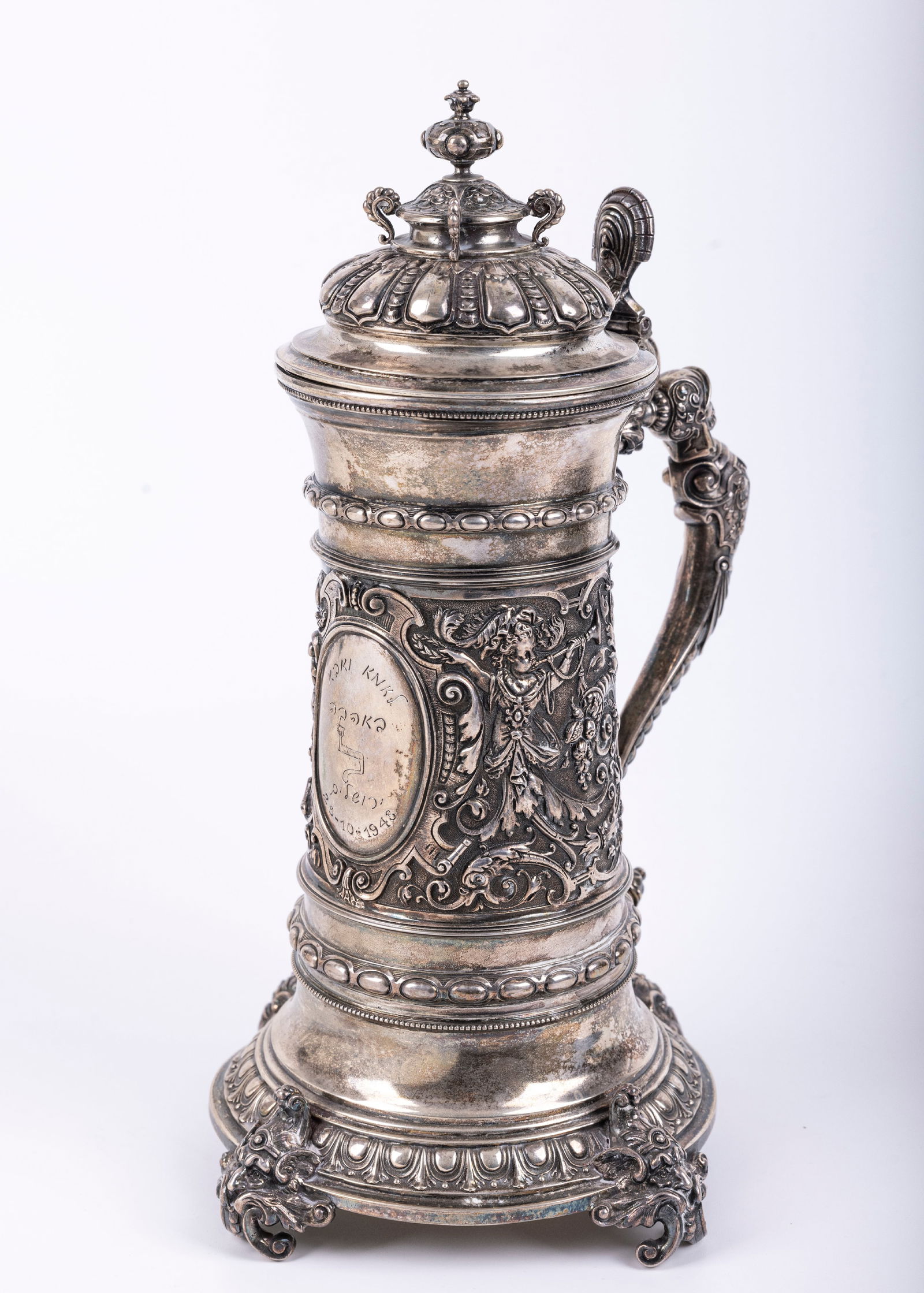 A VERY LARGE SILVER HIGHLY DECORATED STEIN. Germany, c. 1880 with a later inscription. On four (1 of 9)