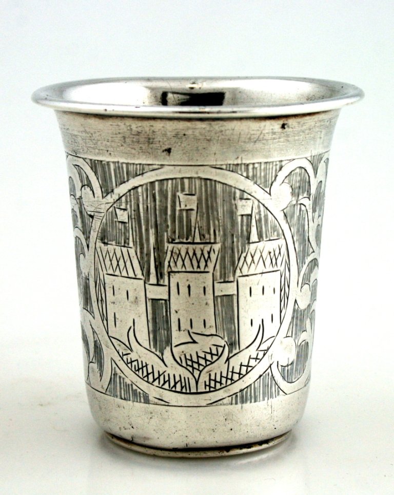 A LARGE SILVER KIDDUSH BEAKER. Warsaw, c. 1870.: A LARGE SILVER KIDDUSH BEAKER. Warsaw, c. 1870. Engraved with vines and city scenes. Exceptionally thick gauge silver. 2.8” tall.