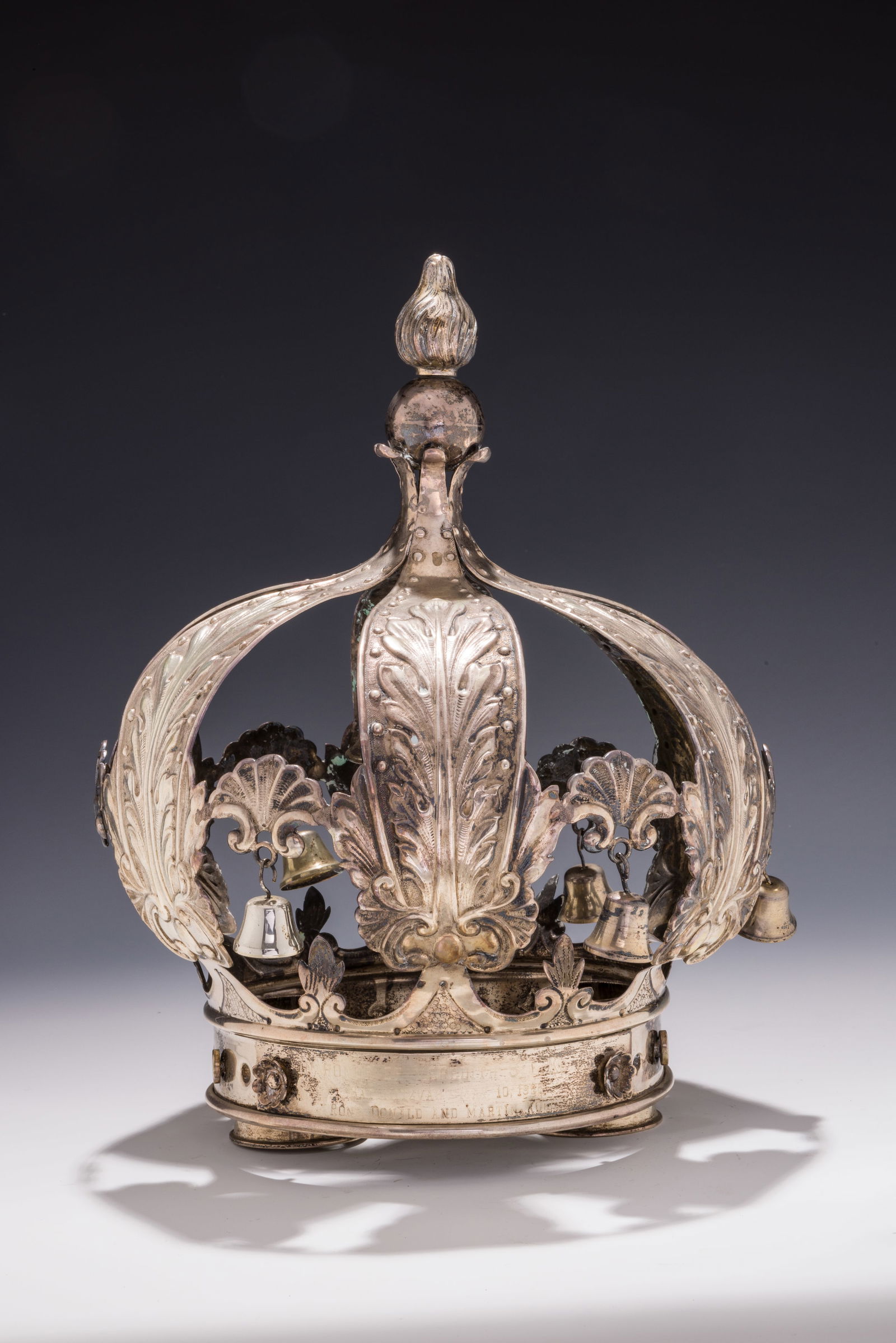 A SILVER TORAH CROWN. Germany, c.1935. Traditional form. With a large center bell surrounded by six (1 of 1)