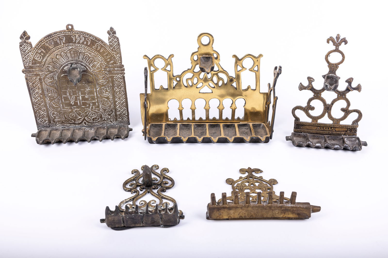 A GROUP OF FIVE BRASS HANUKKAH LAMPS (1 of 1)