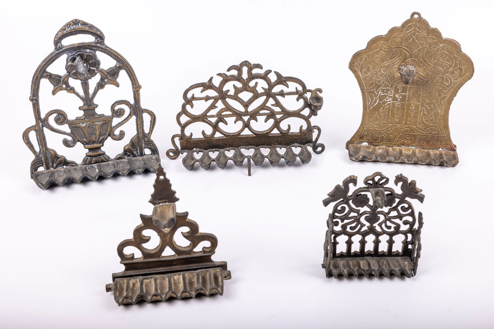 A GROUP OF FIVE BRASS HANUKKAH LAMPS (1 of 1)