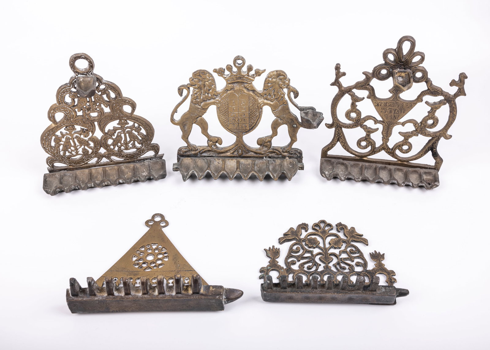 A GROUP OF FIVE BRASS HANUKKAH LAMPS (1 of 1)