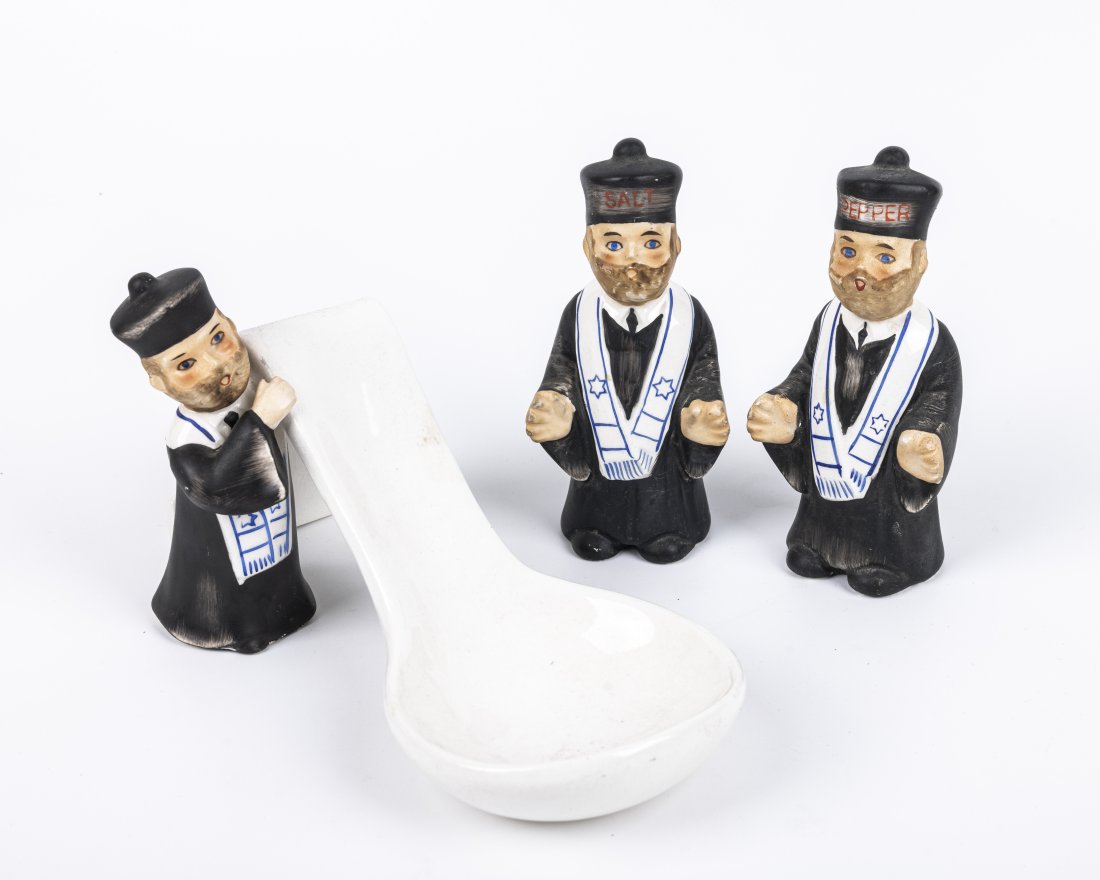 A SET OF CERAMIC TABLE ACCESSORIES IN THE SHAPE OF A JEWISH CANTOR: American, c 1950 One salt shaker, one pepper shaker and one spoon holder 5” tall each