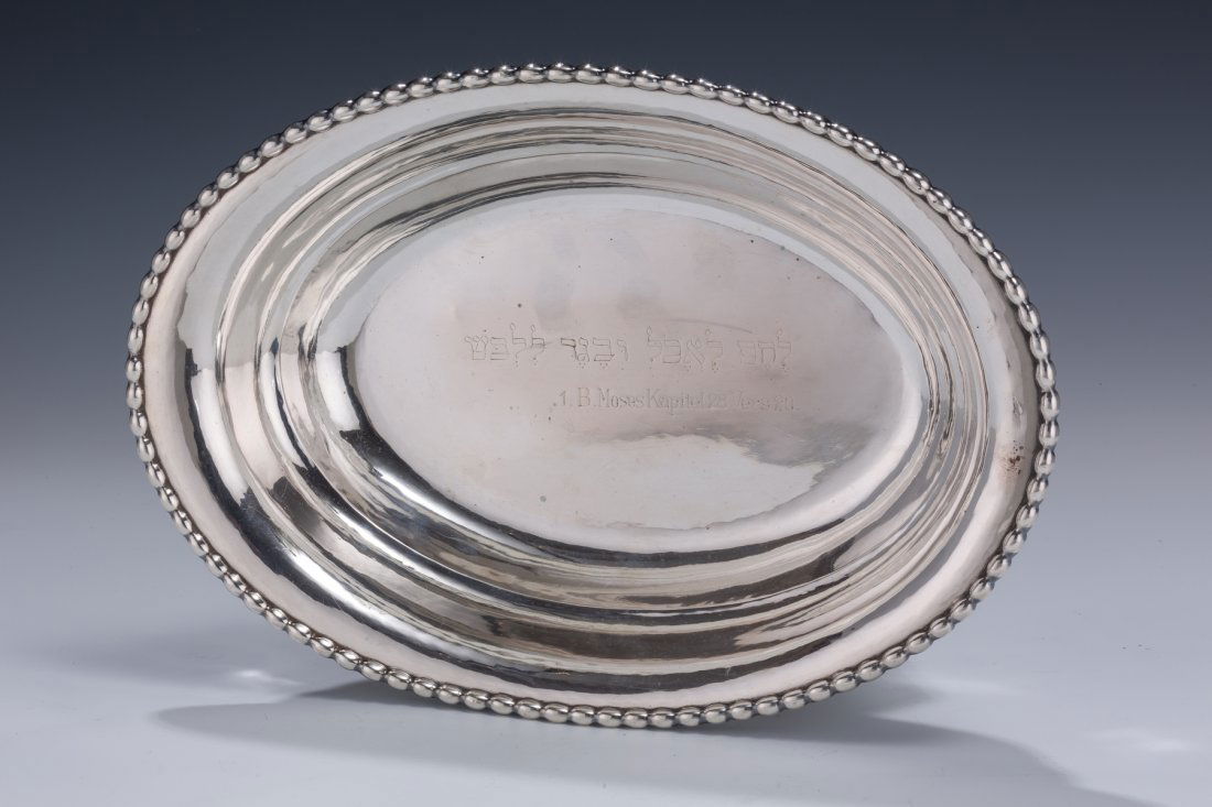 A LARGE SILVER BREAD TRAY BY POSEN: A LARGE SILVER BREAD TRAY BY POSEN. Frankfurt-au-Main, c. 1880. Engraved with Hebrew saying from the Sabbath meal songs and former owner information. Marked. 11.5” wide.