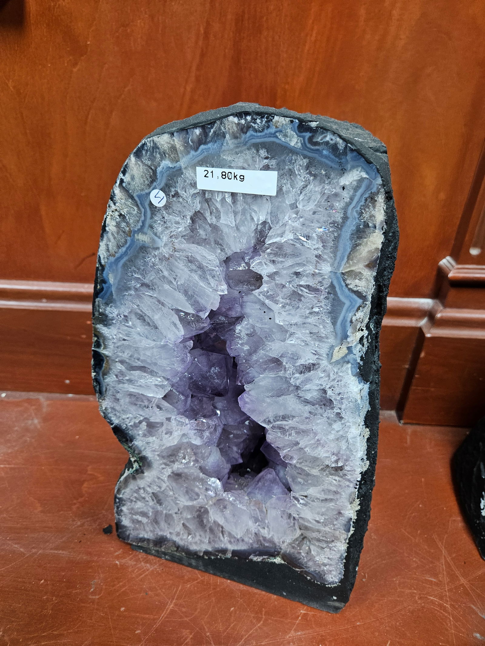 A LARGE AMETHYST GEODE. Polished sides. Excellent light blue coloring. 21.80 kg and 15” tall. (1 of 3)