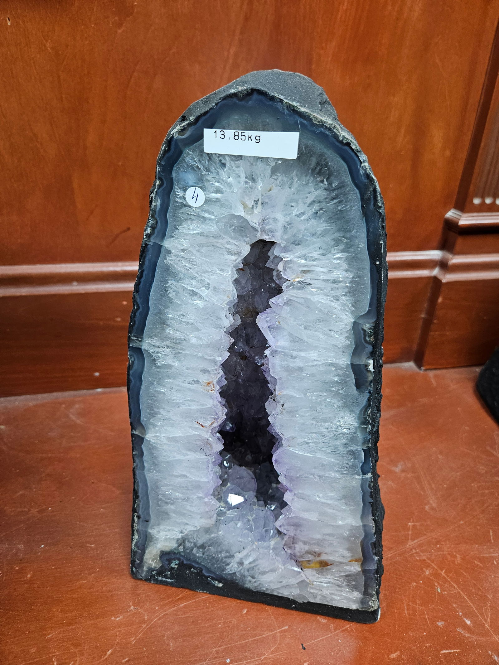 A LARGE AMETHYST GEODE. Polished sides. Excellent light blue coloring. 13.85 kg and 14” tall. (1 of 2)