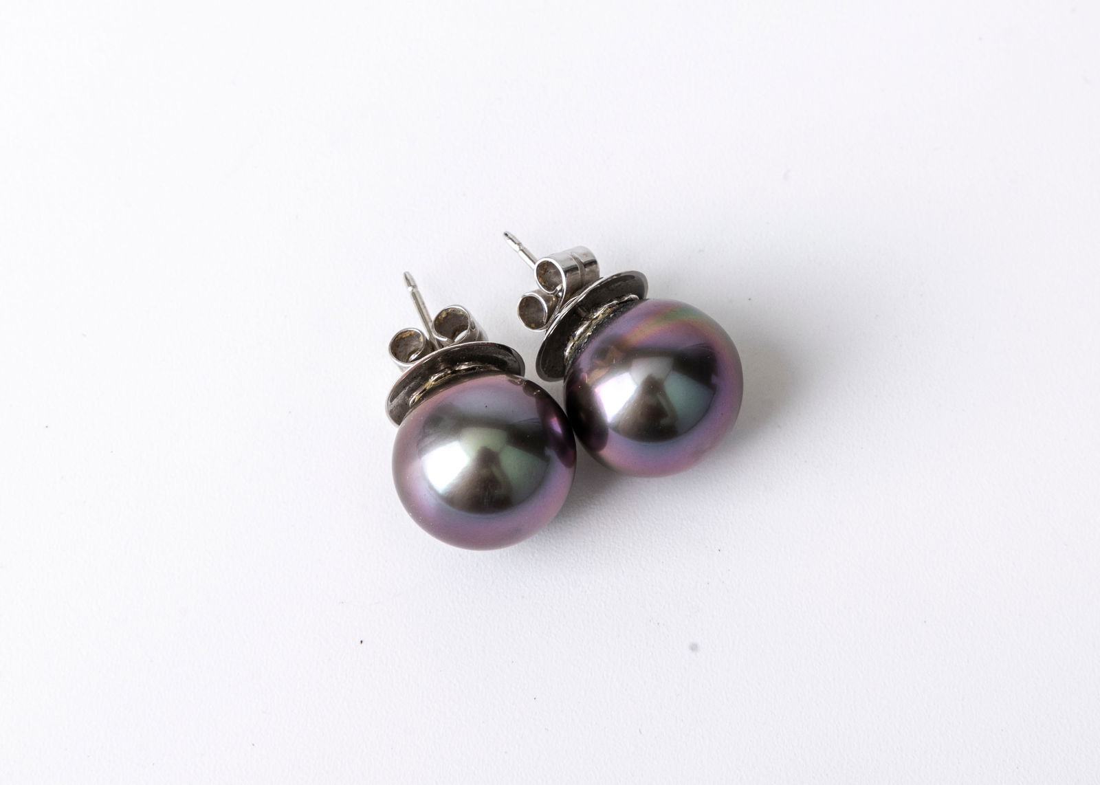 A PAIR OF 18K WHITE GOLD TAHITIAN PEARL STUD EARRINGS.  The pearls are 14.50mm and 14.98 mm. Each sl (1 of 6)