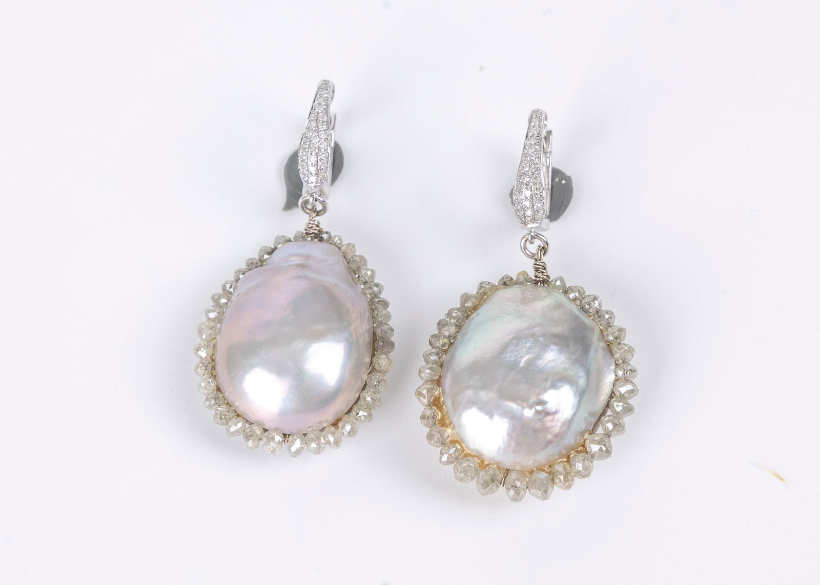 A PAIR OF 14K WHITE GOLD, DIAMOND AND BAROQUE CULTURED PEARL DANGLE EARRINGS. 14K tops are set with (1 of 5)