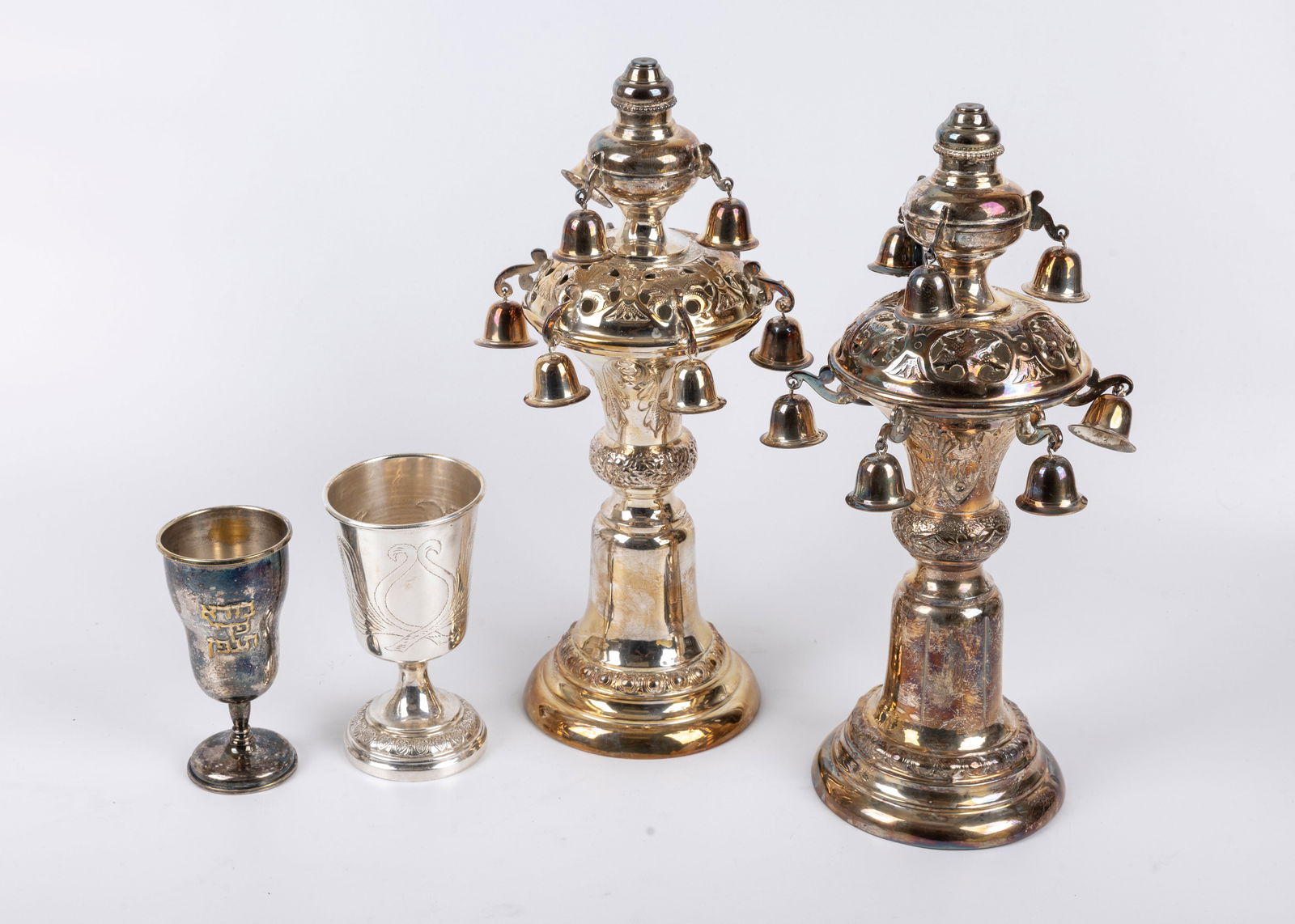 A PAIR OF SILVER PLATED TORAH FINIALS AND TWO KIDDUSH GOBLETS.. Probably Austria, c. 1900. On round (1 of 1)