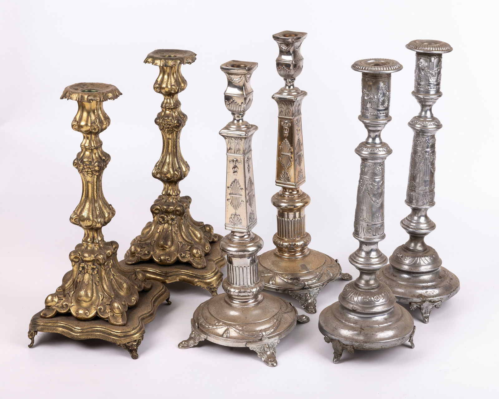 A GROUP OF THREE PAIRS OF SABBATH CANDLESTICKS. Poland, Late 19th century. Each in traditional form. (1 of 1)