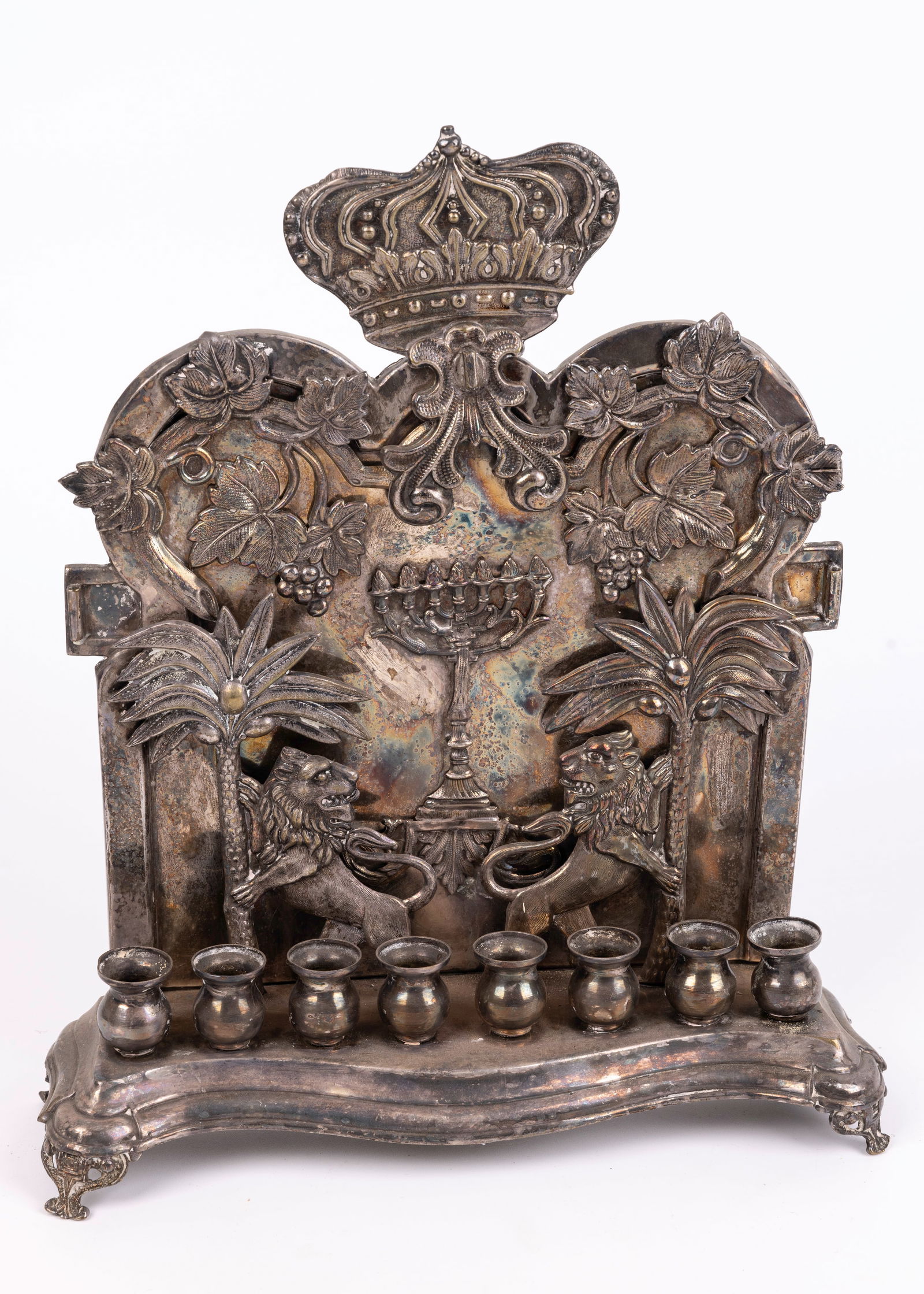 A LARGE HANUKKAH LAMP. Warsaw, c. 1890. On four claw feet. Backplate decorated with two lions (1 of 1)