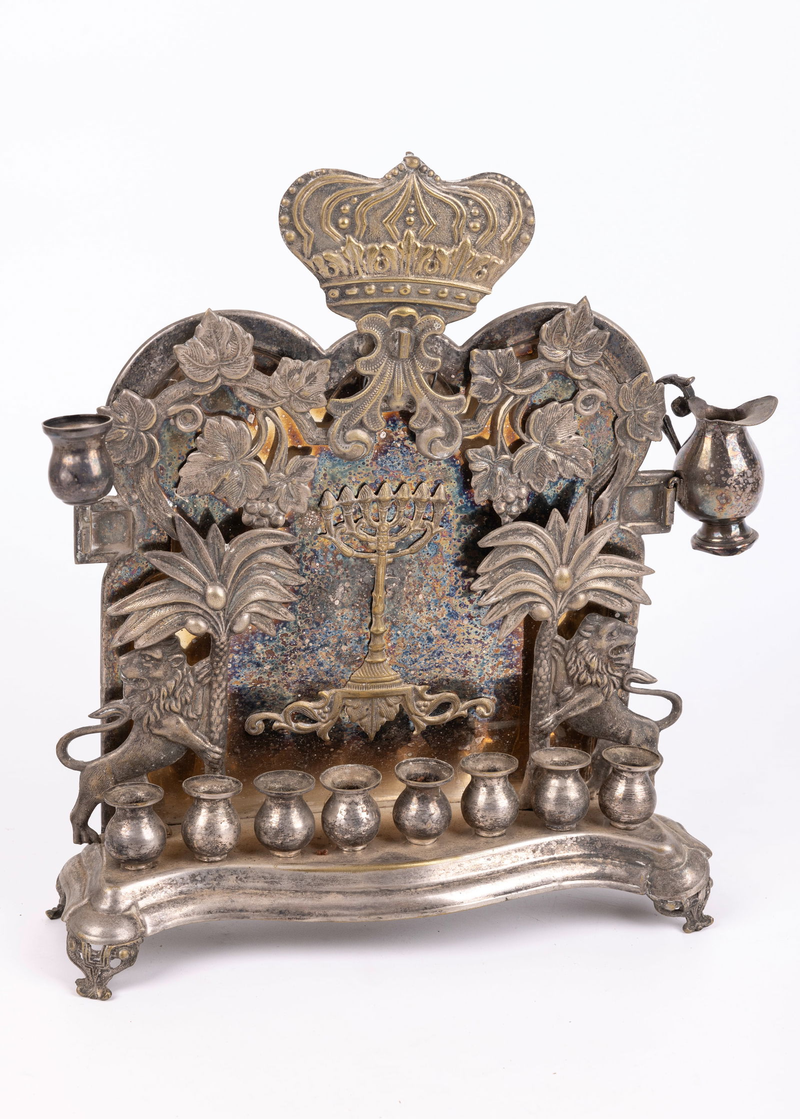 A LARGE HANUKKAH LAMP. Warsaw, c. 1890. On four claw feet. Backplate decorated with two lions (1 of 1)