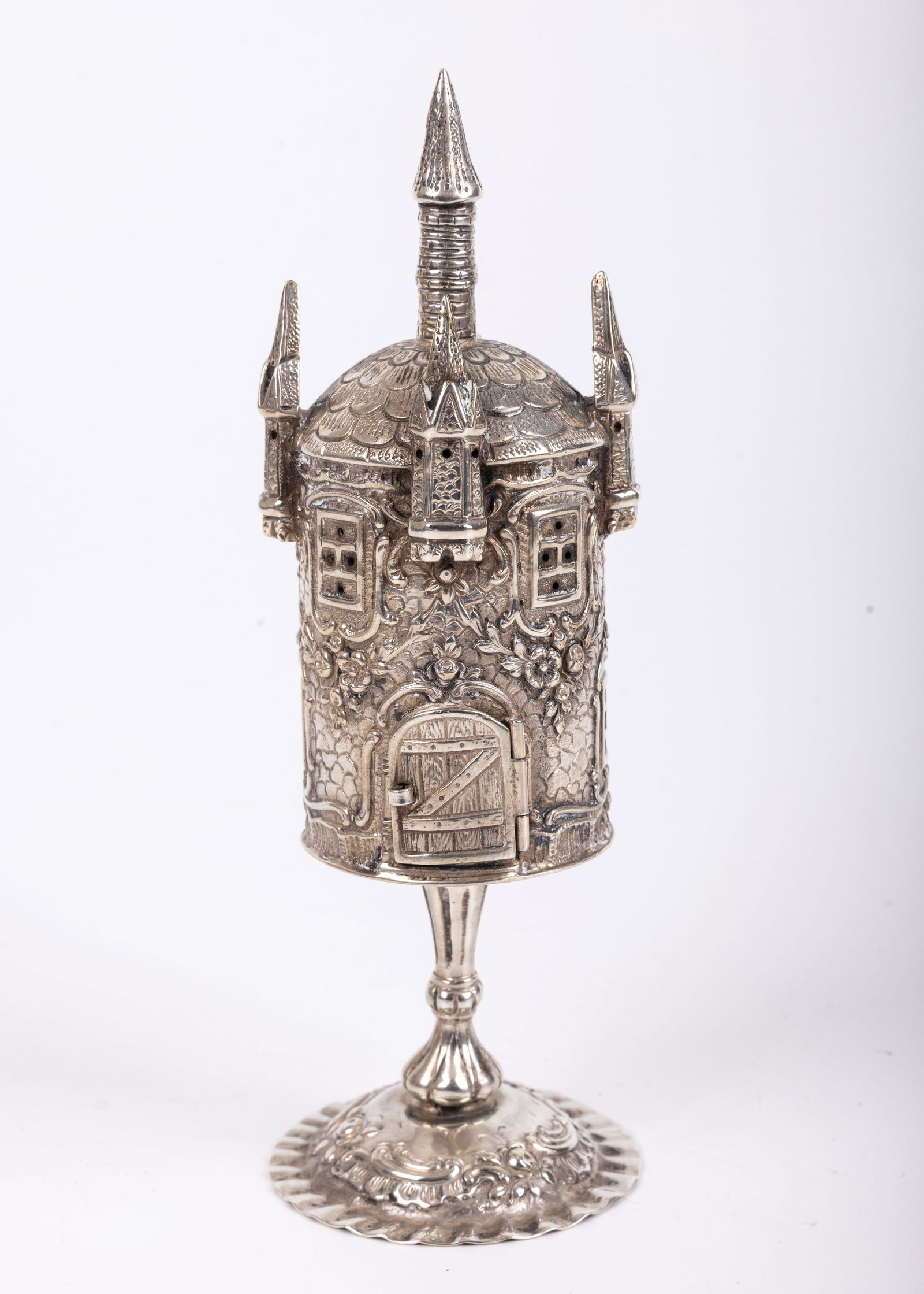 A SILVER SPICE TOWER. Germany, c. 1900. Castle form with crimped base. 7.8” tall. (1 of 3)