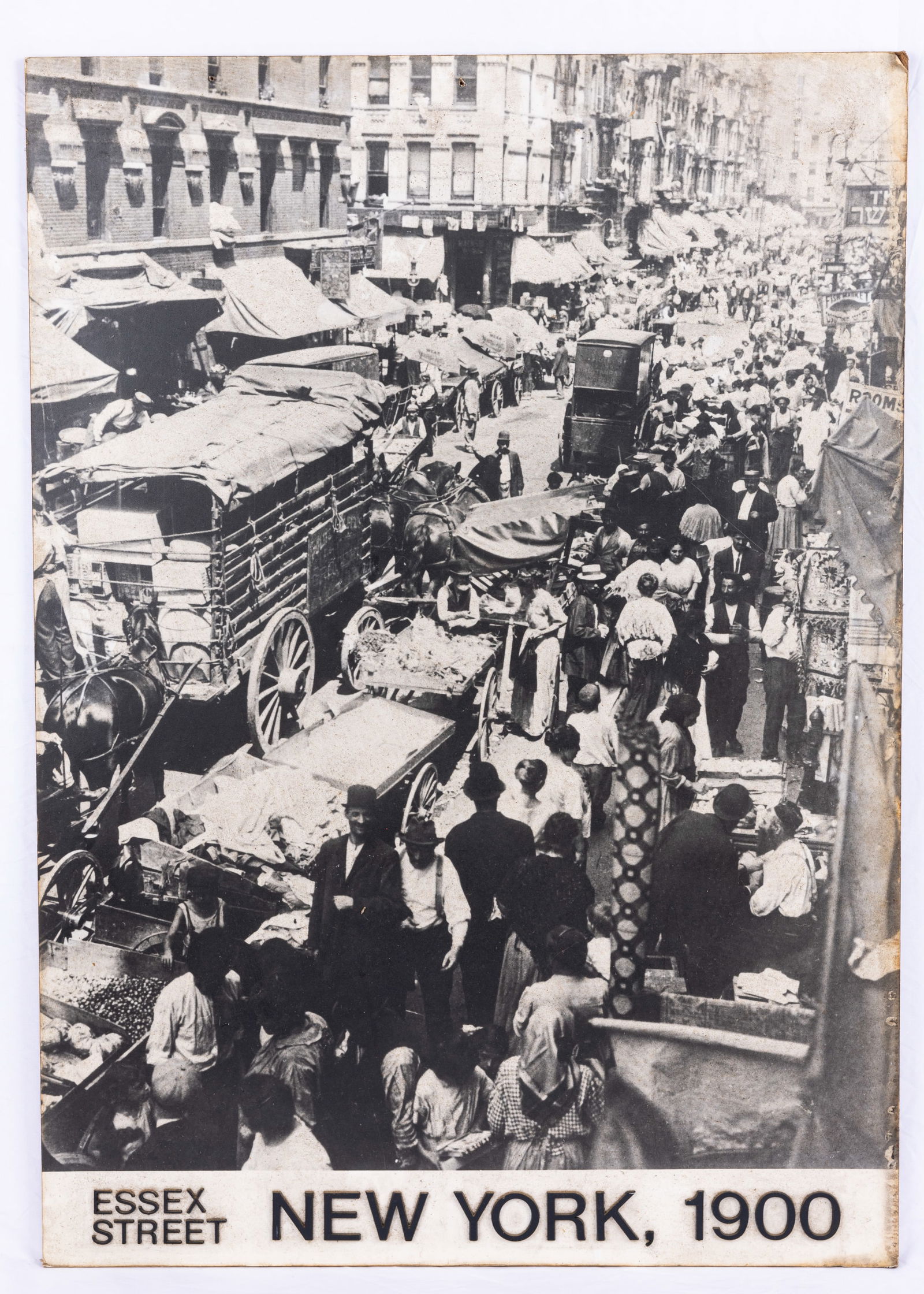 A LARGE PHOTOGRAPH POSTER ON BOARD OF THE LOWER EAST SIDE FROM THE TURN OF THE CENTURY. United