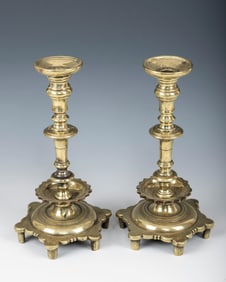 A PAIR OF EARLY SABBATH CANDLESTICKS. Russia or Poland, 18th century. On six feet with a baluster