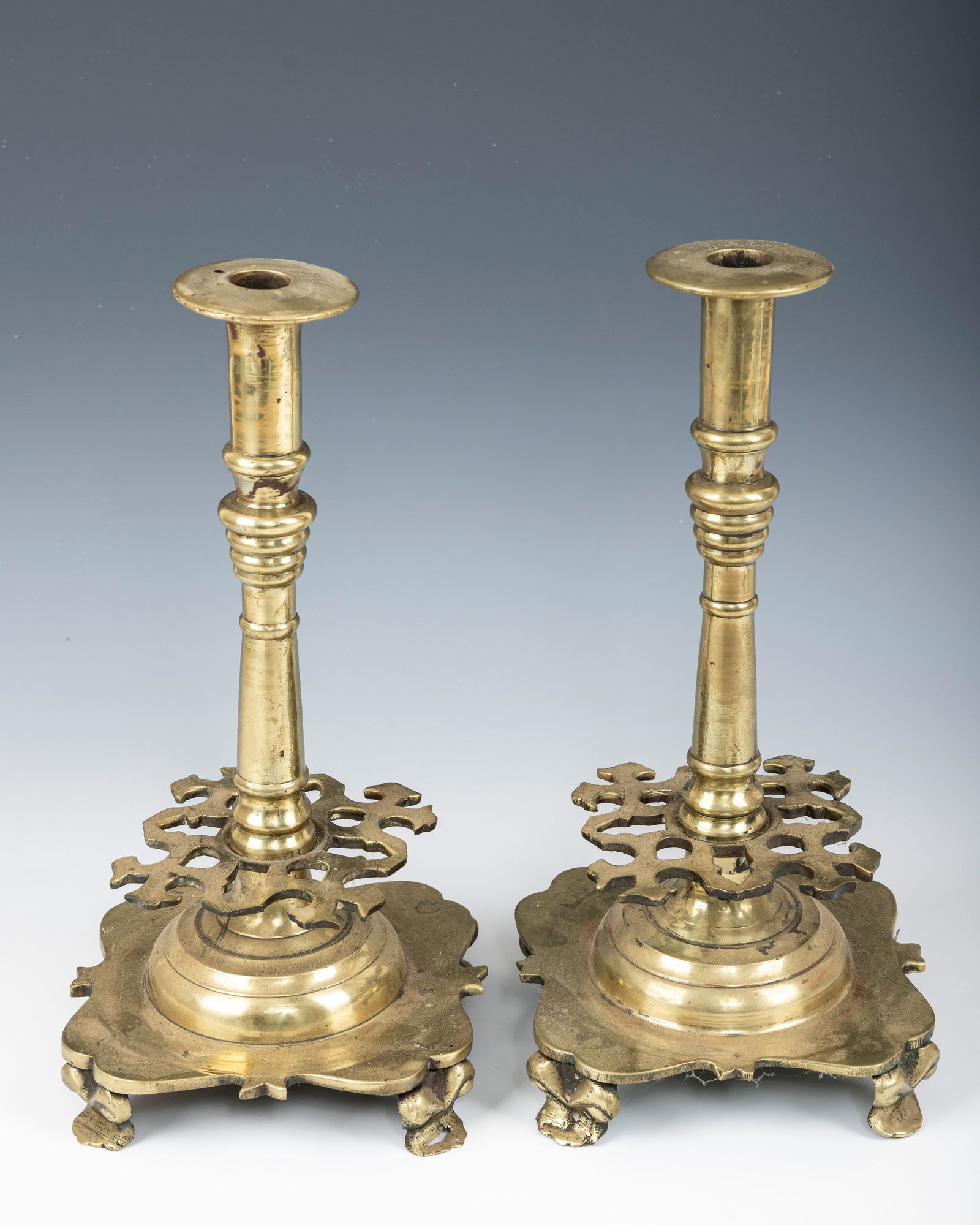 A PAIR OF EARLY SABBATH CANDLESTICKS. Russia or Poland, 18th century. On four feet with ornate wax (1 of 1)