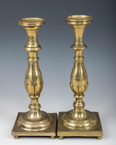 A PAIR OF EARLY SABBATH CANDLESTICKS. Russia or Poland, 18th century. On a square base with a