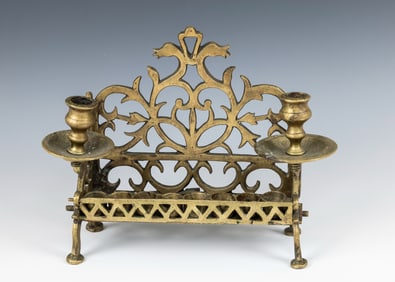 A BRASS HANUKKAH LAMP. Poland, c. 1850. Of traditional form. 11?? wide.