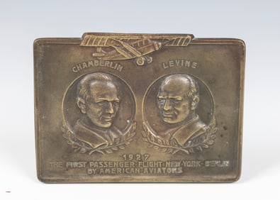 A BRASS COMMEMORATIVE PLAQUE OF THE FIRST PASSENGER FLIGHT FROM NEW YORK TO BERLIN. American, 1922.