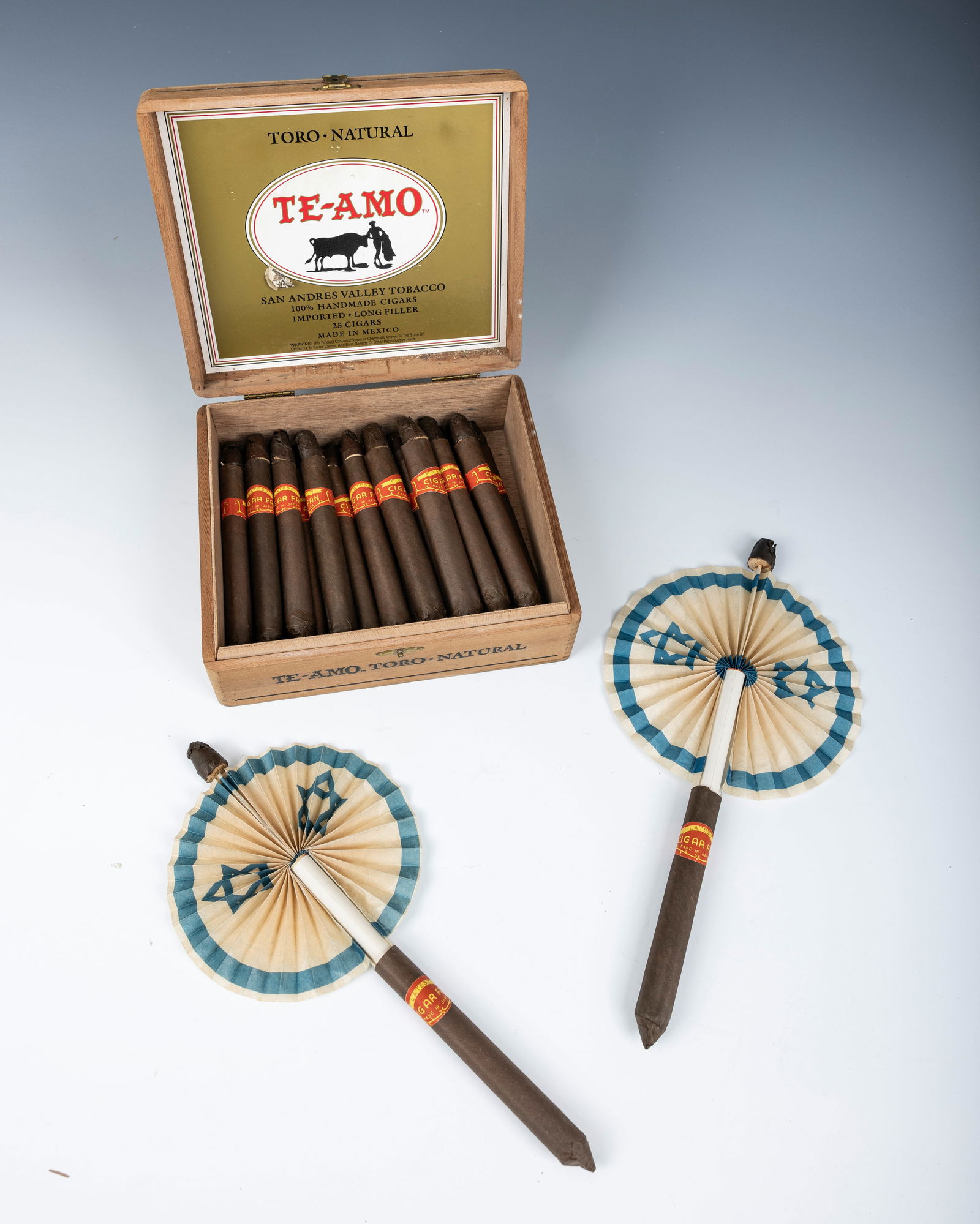 A GROUP OF FAUX CIGARS THAT OPEN UP TO THE FLAGS OF THE JEWISH STATE. C. 1940. In the original cigar: A GROUP OF FAUX CIGARS THAT OPEN UP TO THE FLAGS OF THE JEWISH STATE. C. 1940. In the original cigar box.