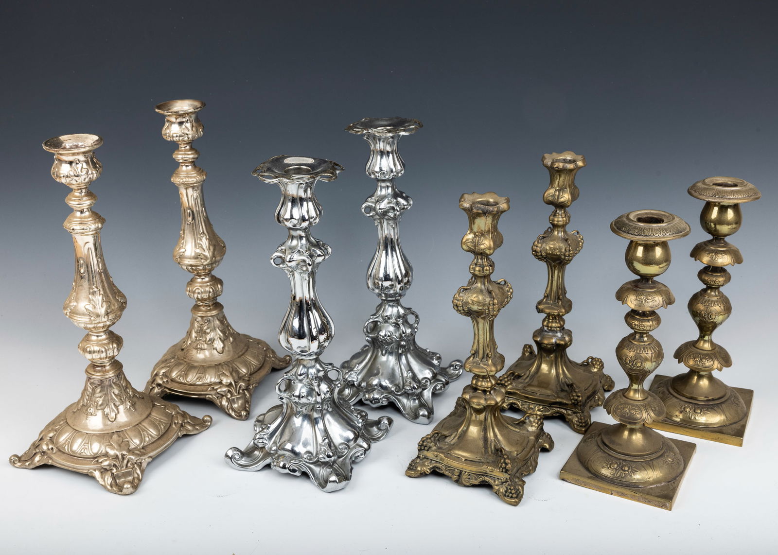 A GROUP OF FOUR PAIRS OF SABBATH CANDLESTICKS. Poland, c. 1880. Each of them has a different style. (1 of 1)