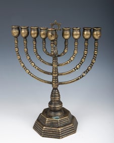 AN ANTIQUE BRASS HANUKKAH MENORAH. Germany, c. 1880. Temple form with octagonal base. 11?? tall.