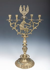 A BRASS SABBATH CANDELABRA. Poland or Ukraine, c. 1800. On a round decorated base with four candle