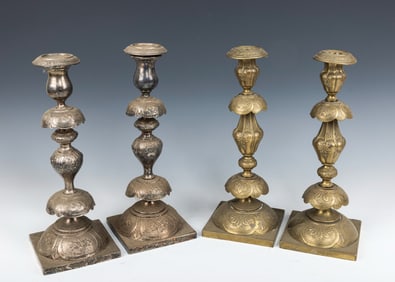 TWO PAIRS OF BRASS SABBATH CANDLESTICKS. Poland, c. 1900. In traditional form with petticoat
