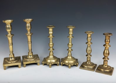 A GROUP OF THREE PAIRS OF BRASS CANDLESTICKS. Russian, English and Continental, 18th and 19th