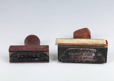 TWO RUBBER STAMPS. One Russian indicating Maaot Chitim and one American from a synagogue.