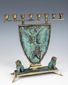 A GREEN PATINATED BRASS MENORAH BY F.J. KORMIS. Israel, c. 1950. Designed by the English sculptor