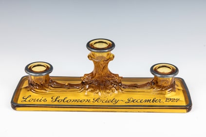 A COLORED GLASS SABBATH CANDELABRA FROM THE LOUIS SOLOMON SOCIETY. New York, 1927. Brown colored