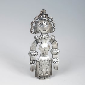 A STERLING SILVER PENDANT BY ILYA SCHOR. New York, c. 1955. In the shape of a modestly dressed