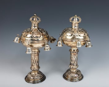 A PAIR OF SILVER TORAH FINIALS. Vienna, c. 1910. On a round embossed base. Engraved with central