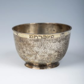 AN EARLY SILVER PASSOVER BEAKER. Germany c. 1750. . Bowl shaped with sharkskin hammered finish.