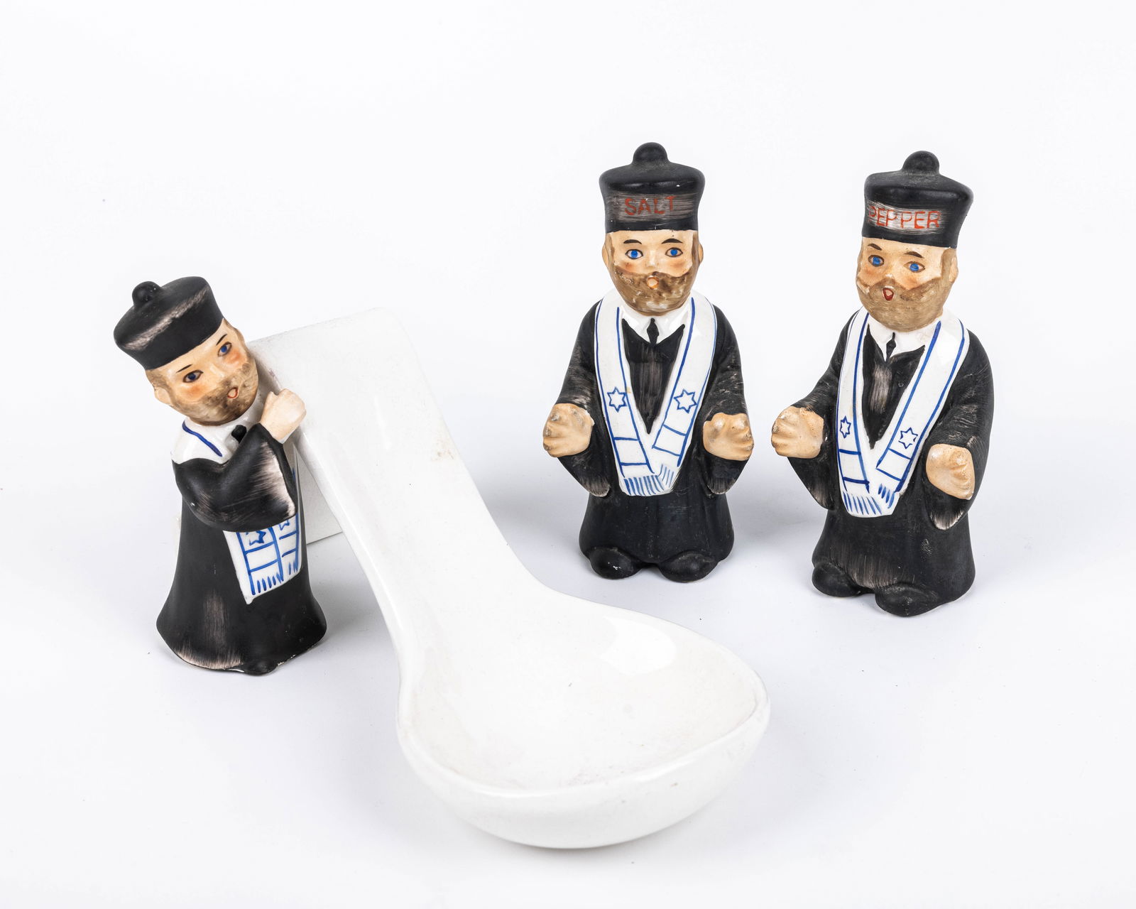 A SET OF CERAMIC TABLE ACCESSORIES IN THE SHAPE OF A JEWISH CANTOR. American, c 1950 One salt (1 of 1)