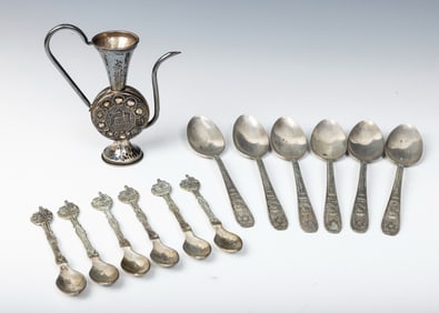 A  TORAH POINTER AND STERLING SILVER FLATWARE AND SMALL PITCHER. Including several spoons.