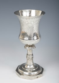 A LARGE SILVER KIDDUSH GOBLET. Poland, c.1820. On an octagonal base with a skirted stem. The upper