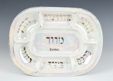 A PASSOVER SEDER PLATE. Karlsbad, c. 1920. With a mother of pearl finish. With the appropriate foods