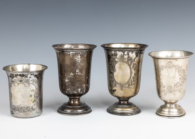 A GROUP OF FOUR SILVER KIDDUSH CUPS. Germany and Austria, c. 1900. Each engraved with engine turned