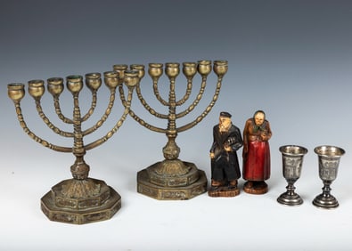 TWO BRASS MENORAHS, BUBBIE AND ZYDE FIGURINES AND TWO SLIVER CUPS. American, c. 1920.